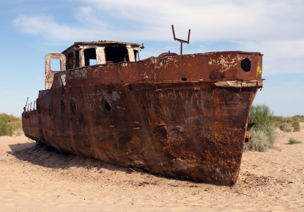 A picture of a rusted out boat